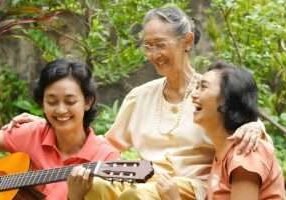 Asian family portrait of old mother relaxing together with her daughter at home